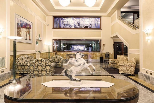 Elegant Doria Grand Hotel lobby, marble flooring, ideal for conferences and receptions.