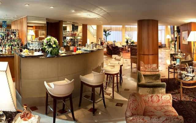 Elegant Milan hotel lounge bar, cocktail reception, networking event