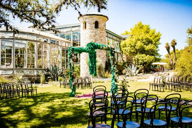 Greenhouse wedding, stone tower, outdoor ceremony