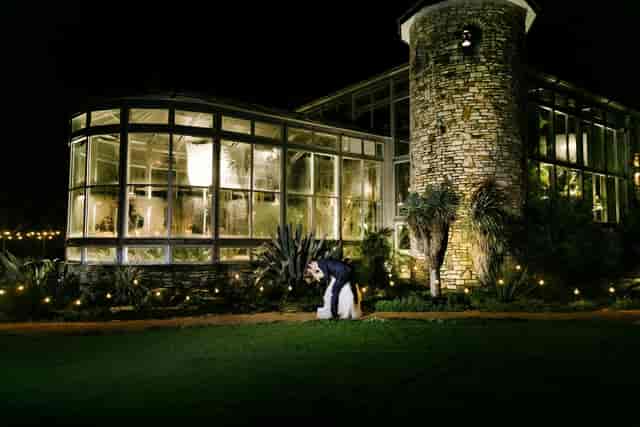 Rustic glass event venue, string lights, wedding gala