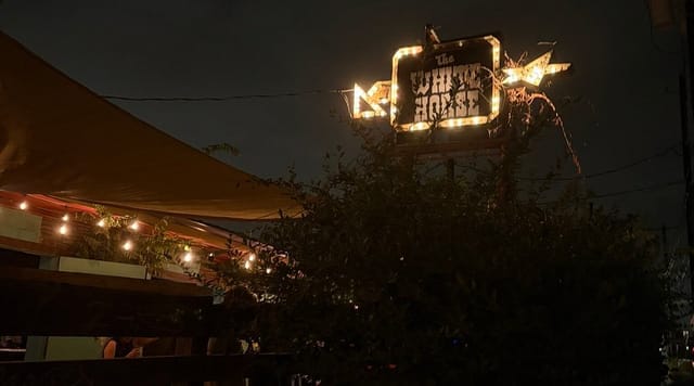 White Horse rustic sign: live music, outdoor event