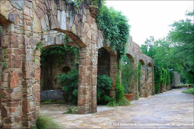 Rustic arch venue, garden reception, historic ceremony.