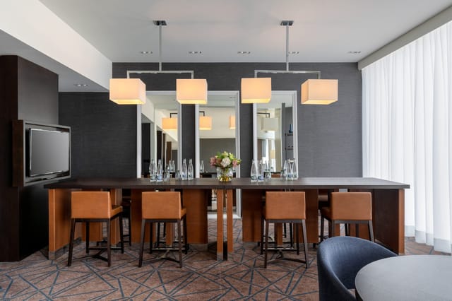 Crowne Plaza executive lounge, board meeting, private dining.
