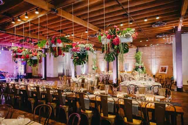 Elegant wedding venue, industrial chic, Brazos Hall, uplighting, floral decor