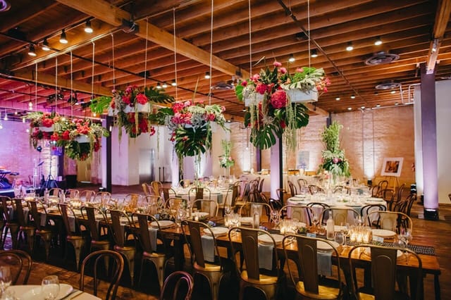 Elegant wedding venue, industrial chic, Brazos Hall, uplighting, floral decor