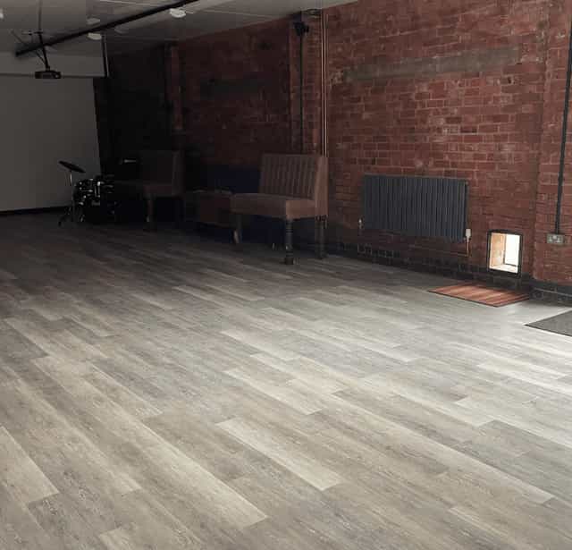 Industrial chic event venue, exposed brick, workshop, performance