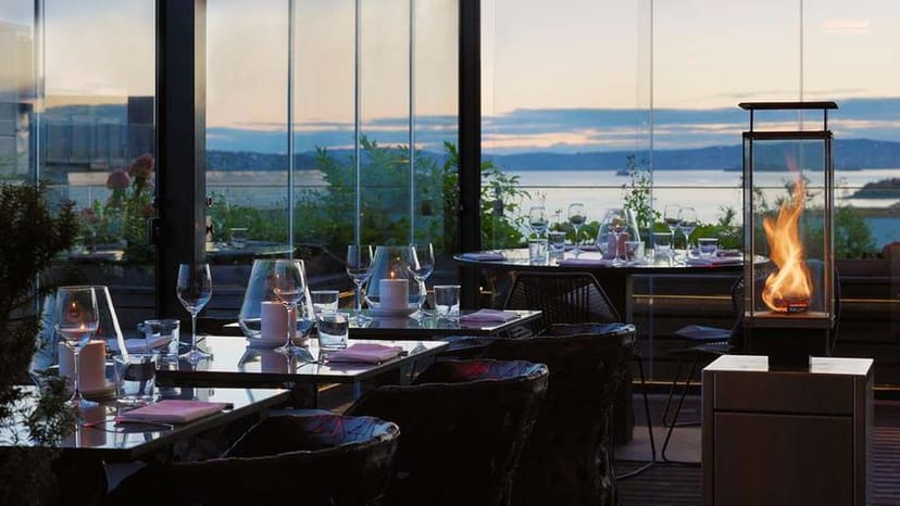 Rooftop dining at Pipervika in THE THIEF, elegant sunset view for upscale events.