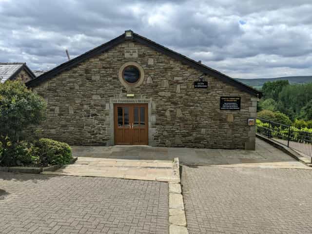 Rustic room, stone facade, private event, small gathering.