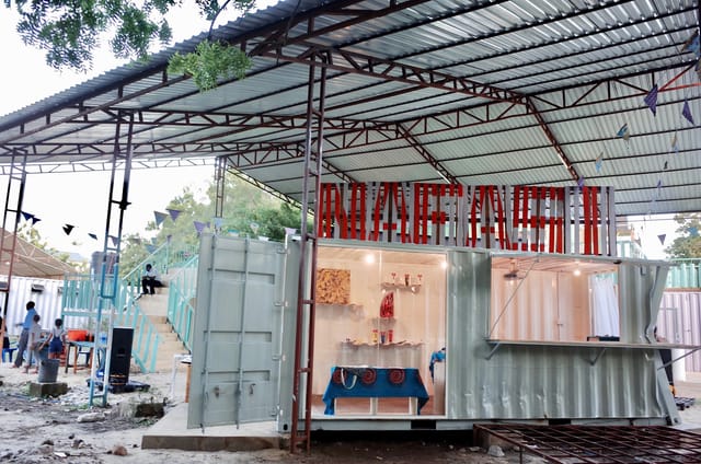 Nafasi Art Space outdoor event venue: modular shipping containers, rustic design.