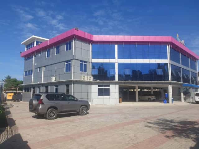 Ukumbi Sea Breeze Hall event venue, pink roof, modern facade
