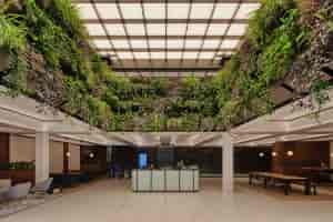 Broadway Meeting Room at HubHub: modern space with greenery for wellness events.