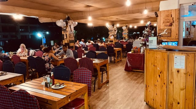 Mamboz restaurant event: rustic tables, patterned seats, casual party venue