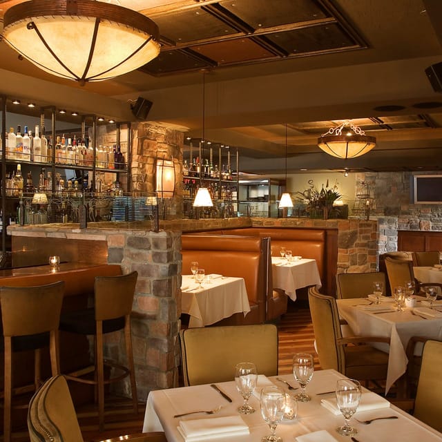 Roaring Fork restaurant: elegant bar, stone accents, corporate events