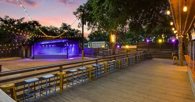 Outdoor venue, string lights, corporate event, product launch