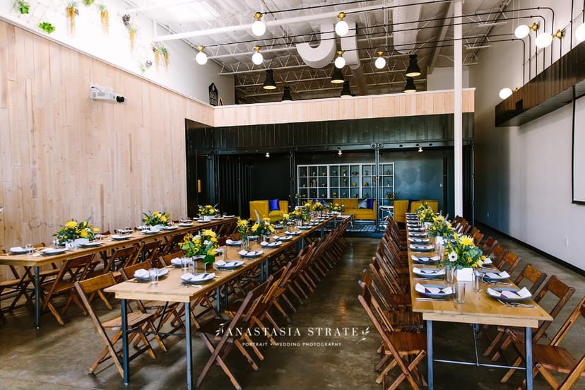 Industrial chic event space with communal tables - banquet, wedding
