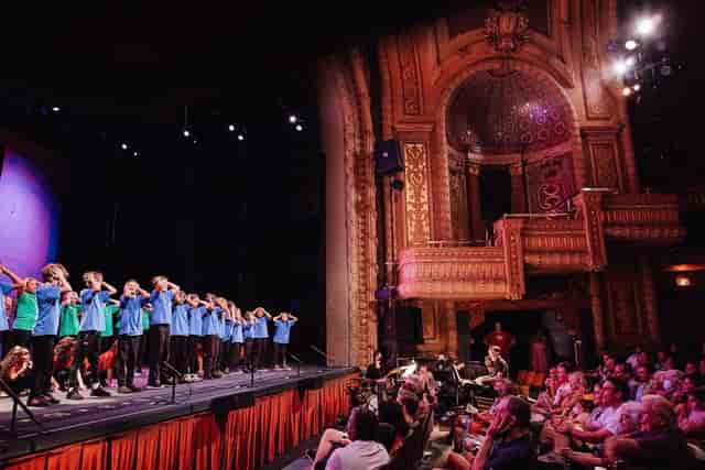 Paramount Theatre youth performance, ornate auditorium, vibrant event