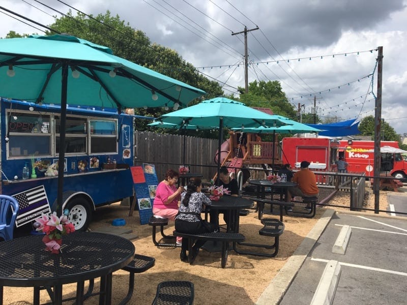 Austin food truck event, outdoor dining, casual gathering.