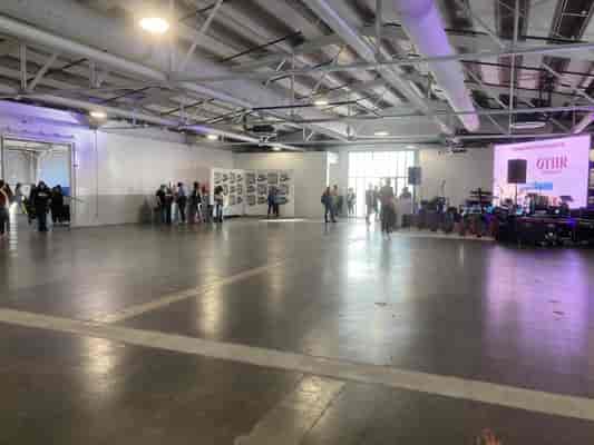 Industrial pop-up event space, concrete floor, stage & AV
