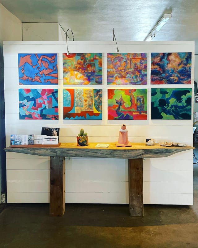Abstract art gallery event space, rustic table