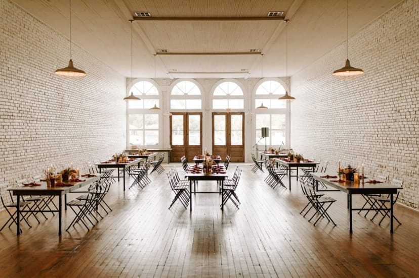 Loft event space, white walls, intimate dining, reception venue