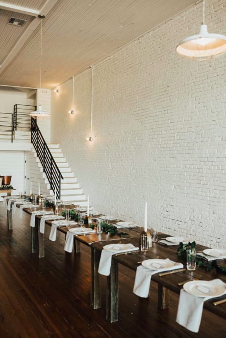 Industrial-chic venue: brick, stairs, dinner, workshop