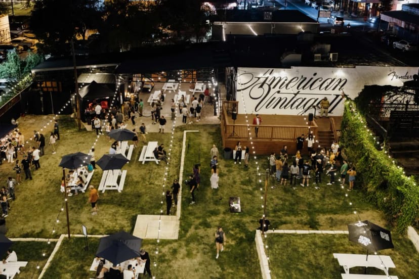 IYKYK Inn Cahoots outdoor event venue picnic tables string lights