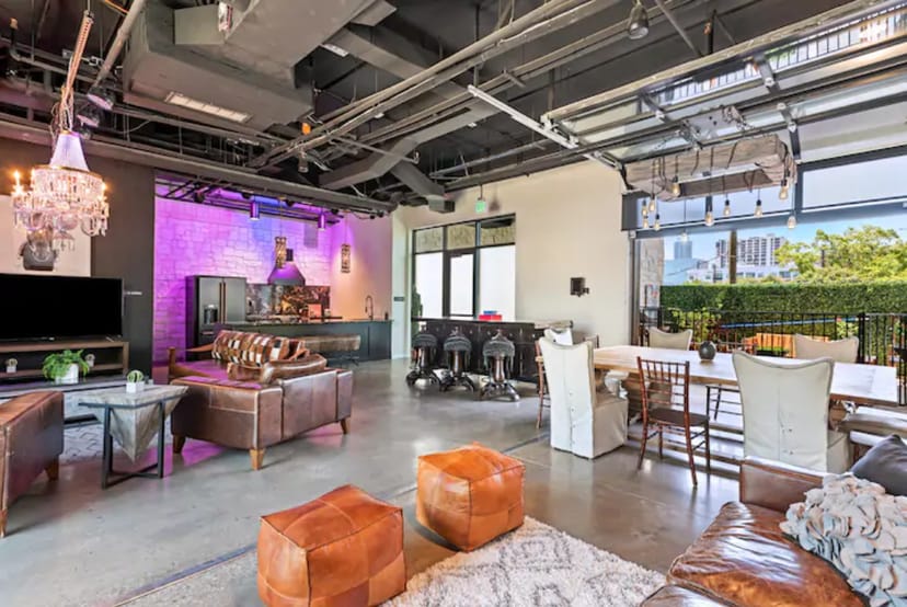 Rooftop event space, industrial chic, networking, corporate.