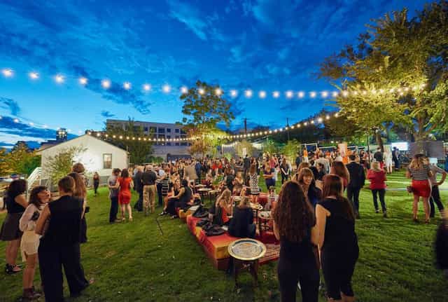 Outdoor networking reception, string lights, corporate event