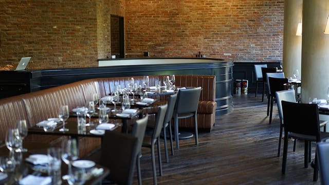 Scarpetta bar lounge, brick, plush seating, NYC restaurant event