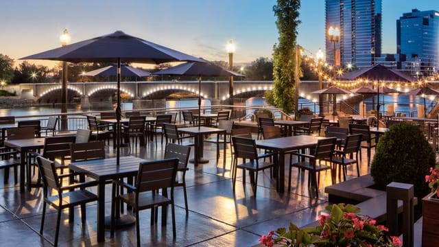Wolfgang Puck patio: waterfront event, umbrellas, lights