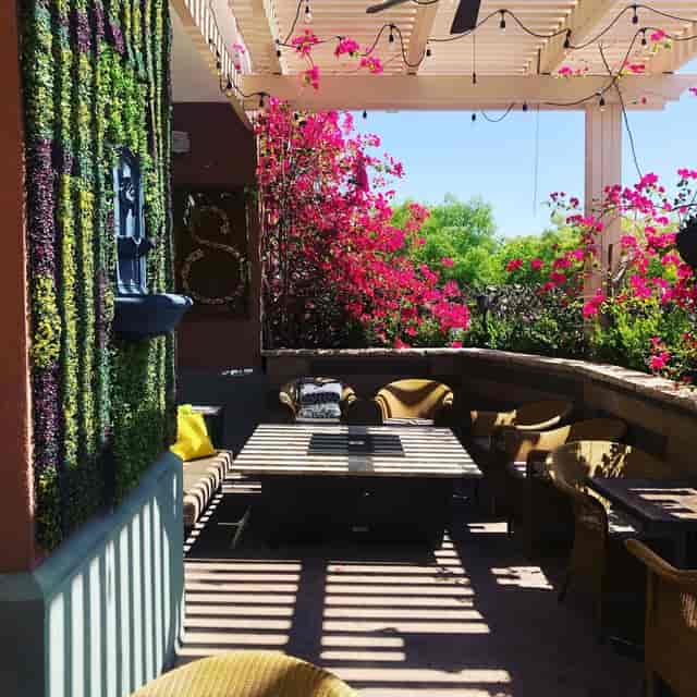Naples pizzeria patio event: seating, fire pit, floral, networking