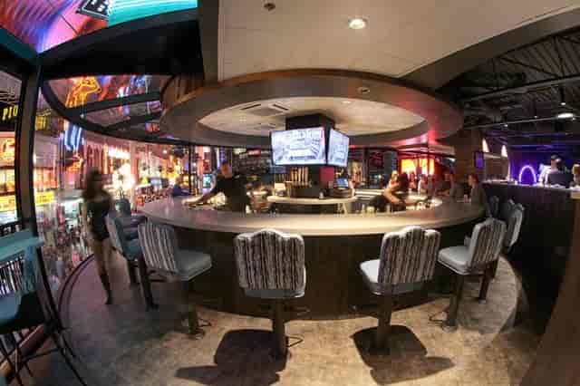 Vibrant saloon party room, circular bar, cocktail reception, networking event