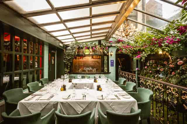 Elegant meeting space with lush greenery for corporate and intimate events in Boisdale.