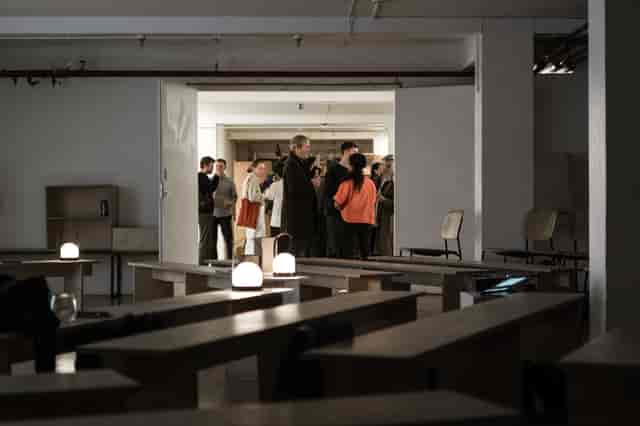 Minimalist event space in Custom Lane with warm lighting for networking and gatherings.