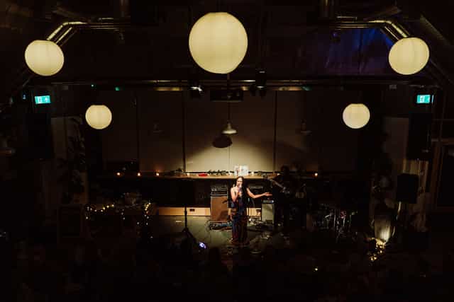 Solo concert at The Grounds, intimate venue, product launch event