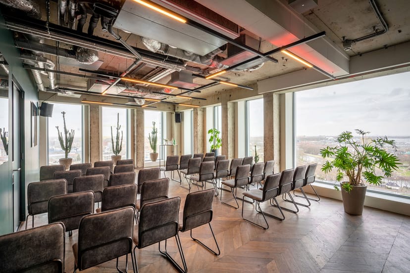 Stylish minimalist meeting space with large windows at ADAM Events for conferences and workshops.