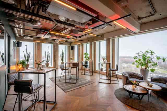 Modern event space with large windows for networking and gatherings at ADAM Events.