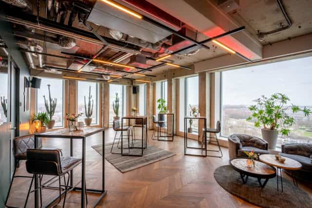 Modern event space with large windows for networking and gatherings at ADAM Events.