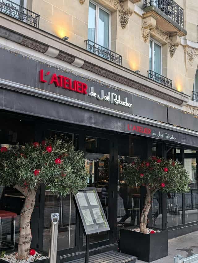 Robuchon event: elegant restaurant signage, greenery, corporate dinner