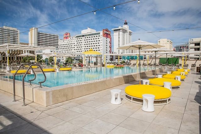 Grand Hotel Pool Deck, vibrant event venue, upscale lounge, pool