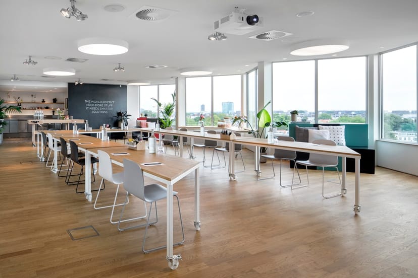 Modern meeting space in Zoku Amsterdam with natural light, ideal for workshops and presentations.