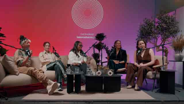 Panel discussion at Qube Elephant Lounge with vibrant decor, ideal for conferences.