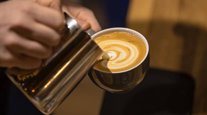 Barista latte art, premium coffee break, conference cafe