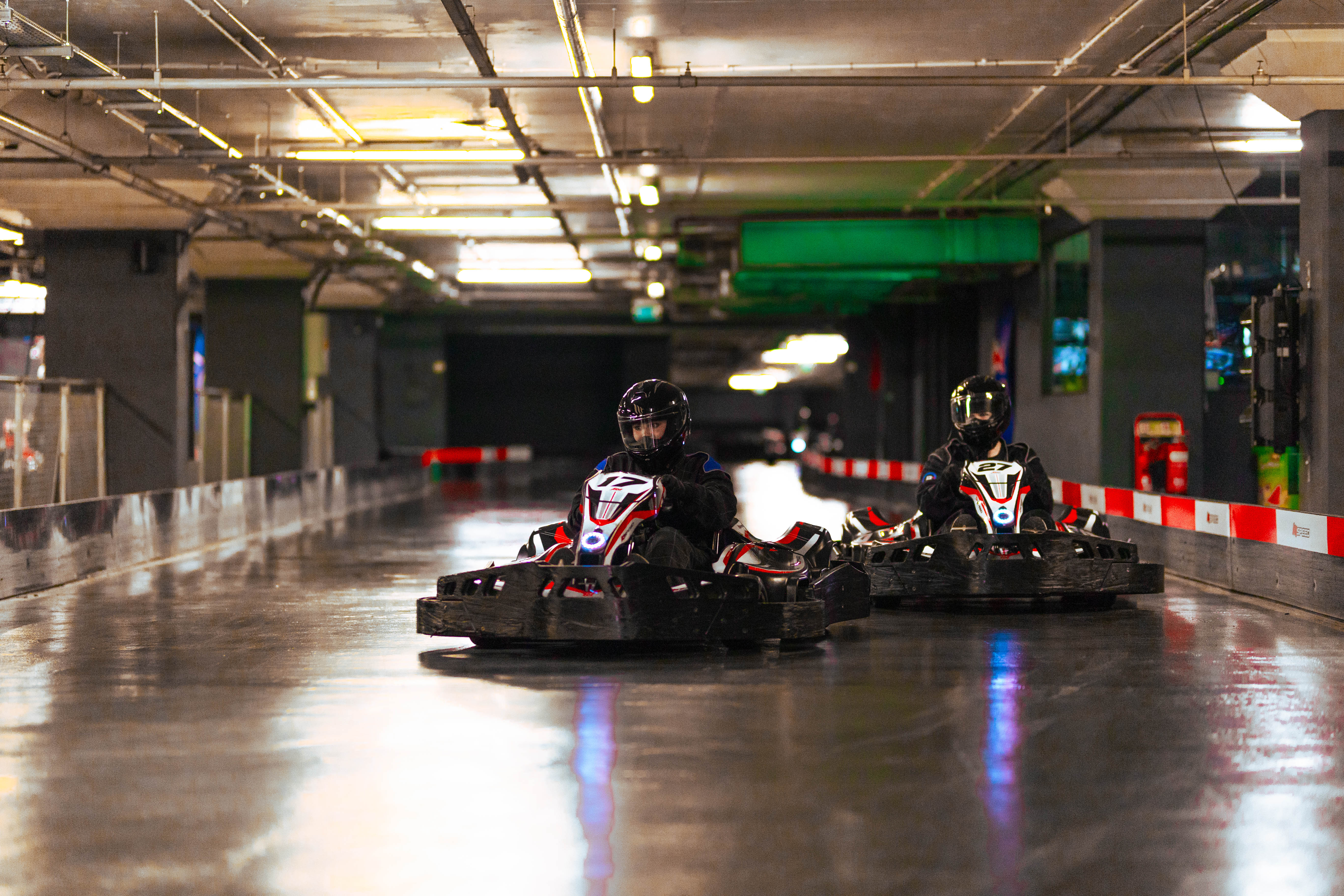 Indoor karting track at K1 Speed Canary Wharf for team-building and corporate events. - Banner