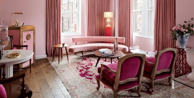 First Lady Suites meeting space in DC, featuring elegant pink decor for networking events.