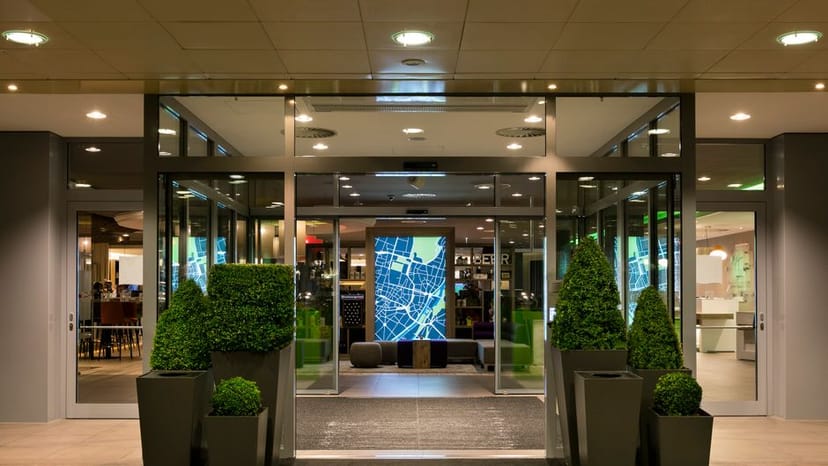 Holiday Inn Munich event entrance, digital map, modern green