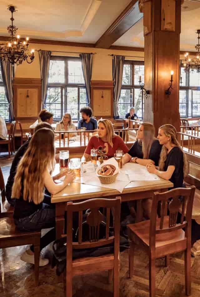 Bavarian beer hall, rustic communal seating, corporate event, team building