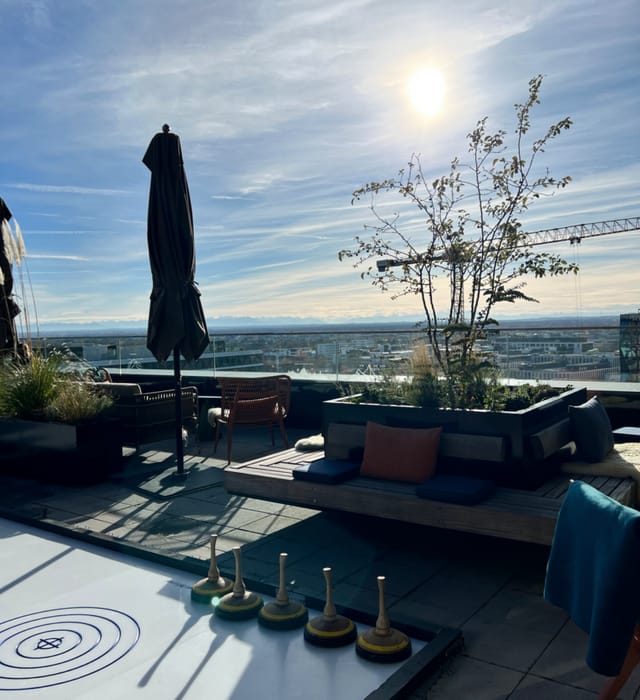 Rooftop bar terrace networking event cityscape