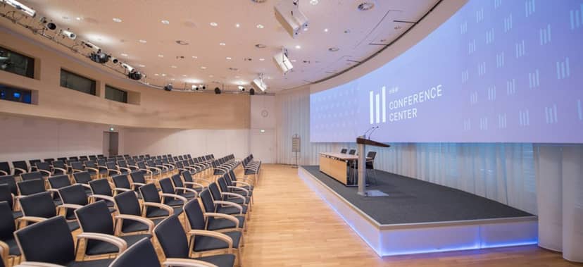 Munich conference hall, tiered seating, corporate event, presentation