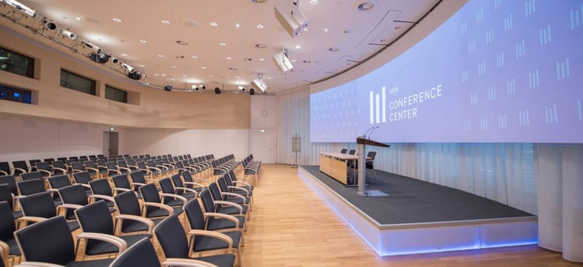 Munich conference hall, tiered seating, corporate event, presentation